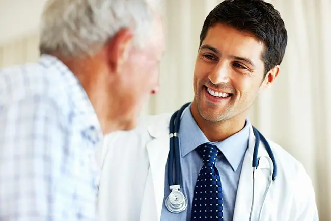 caring-doctor-with-ill-patient