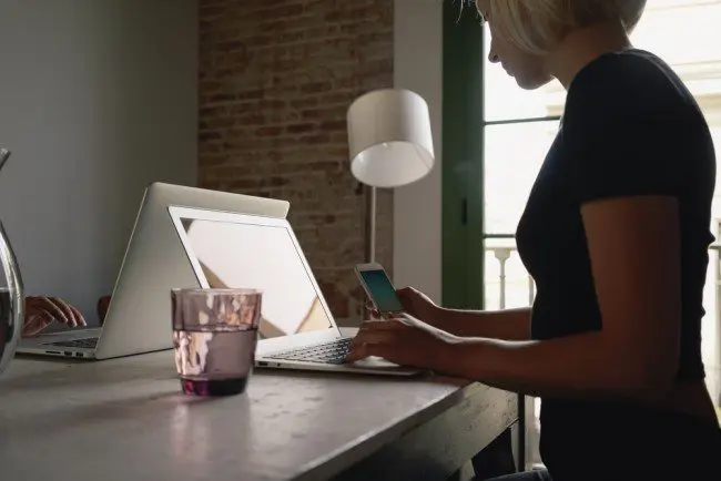 Record numbers of people work from home in the UK but a lack of office gossip and flirting cited as two of the things most missed