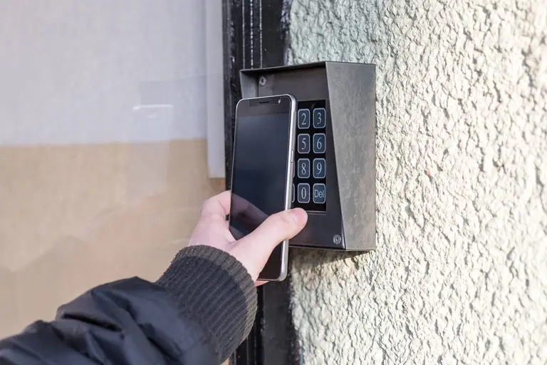 Man open the safety door with smart phone