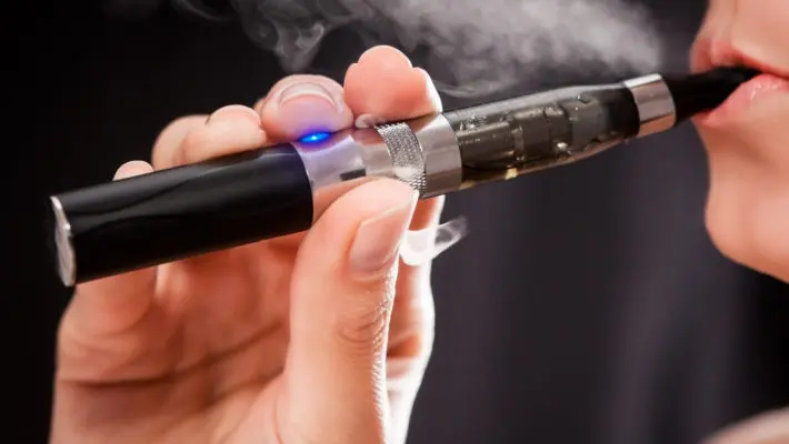 Woman smoking with electronic cigarette
