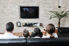 Happy young family have fun and working on laptop at modern  home livingroom indoor