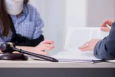 Injured employee visiting lawyer for advice on insurance