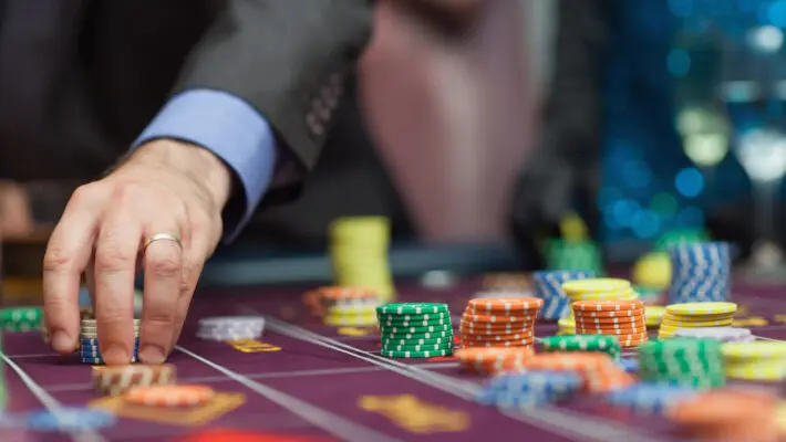 Man placing a bet at the casino
