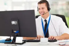 technical support operator working on computer