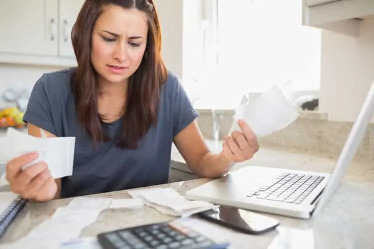 woman looking at bills