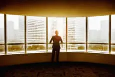 Business Man looking out the window