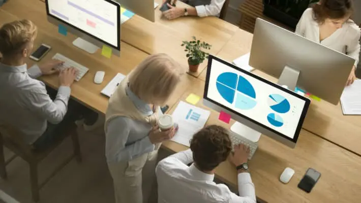 Corporate,Employees,Group,Working,On,Desktop,Pc,Computers,And,Talking