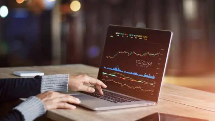 Businessman,Using,Laptop,For,Analyzing,Data,Stock,Market,,Forex,Trading