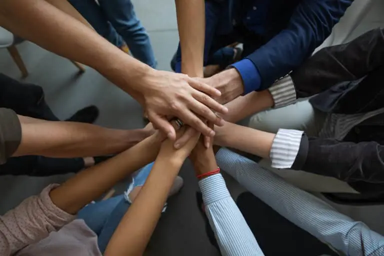 Close,Up,Mixed,Race,Business,People,Putting,Hands,Together,,Support