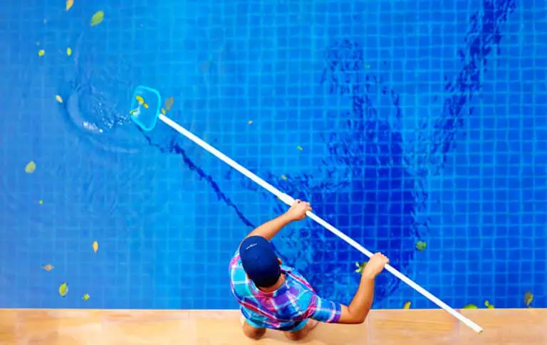 Young,Adult,Man,,Personnel,Cleaning,The,Pool,From,Leaves