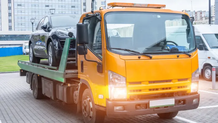 Passenger,Car,Loaded,Onto,A,Recovery,Truck,For,Transportation