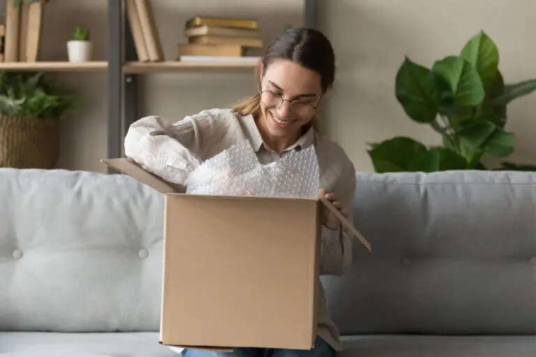 Smiling,Satisfied,Young,Woman,Customer,Sit,On,Sofa,Unpack,Package