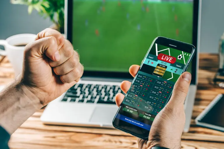 Lucky,Man,Celebrating,Victory,After,Making,Bets,Using,Gambling,Mobile