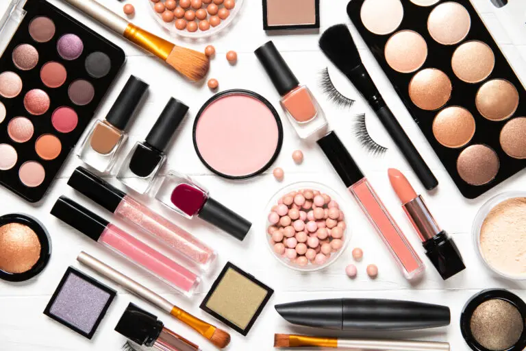 Decorative,Cosmetics,And,Makeup,Brushes,On,A,White,Background,,Top