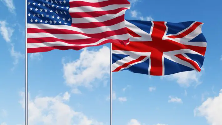 Uk,And,Usa,Flags,On,A,Blue,Sky,Background.