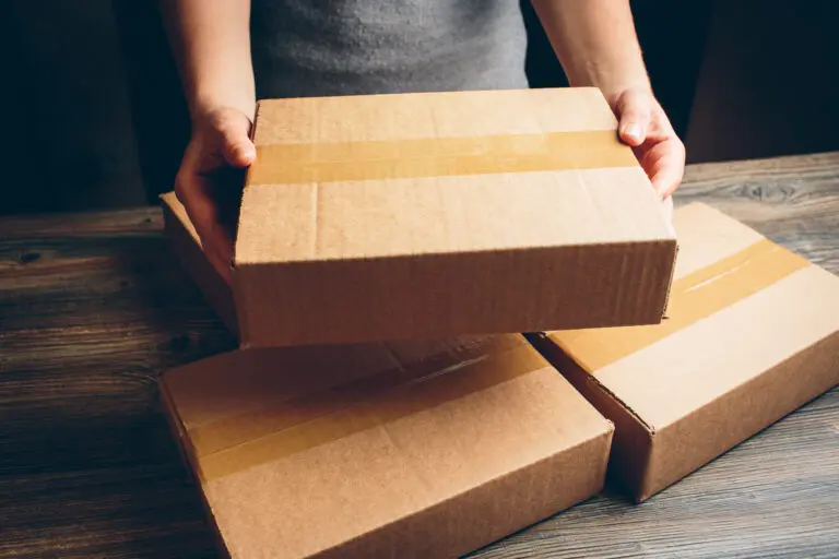 Girl’s,Hands,Holding,The,Package,On,The,Table