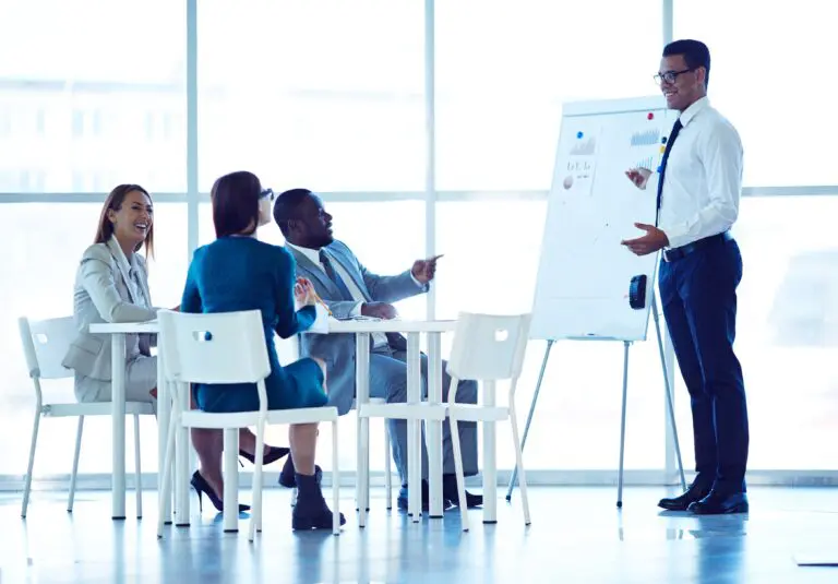 Cheerful,Business,People,Looking,At,Successful,Specialist,Explaining,New,Project