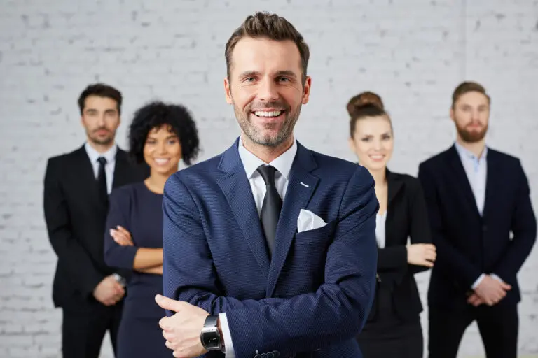 Group,Of,Business,People,With,Leader,At,Front