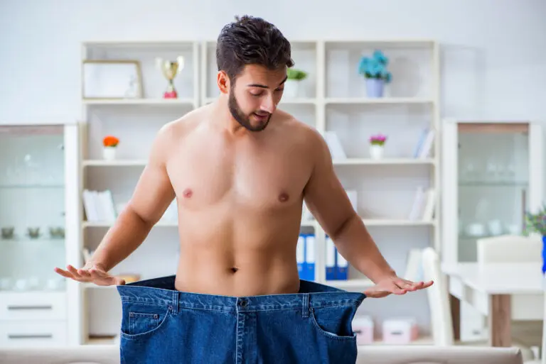 Man,In,Oversized,Pants,In,Weight,Loss,Concept