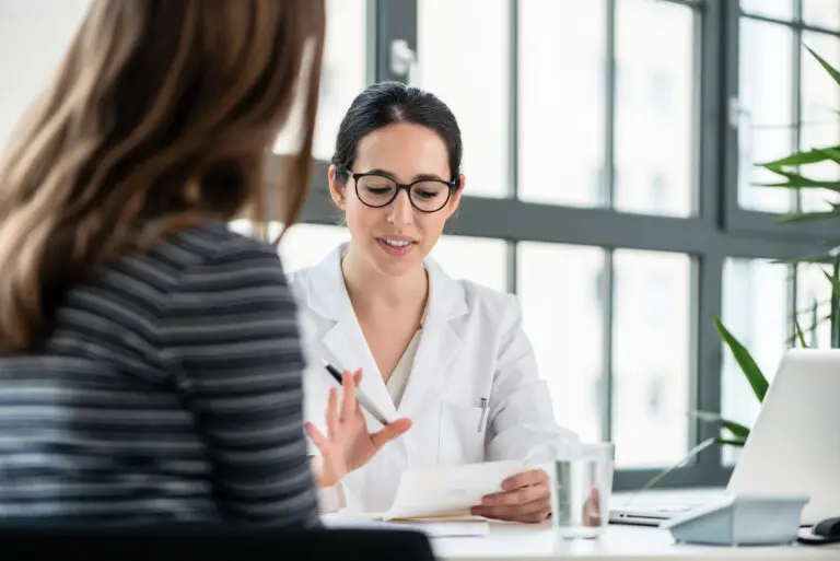 Female,Physician,Listening,To,Her,Patient,During,Consultation,While,Sitting