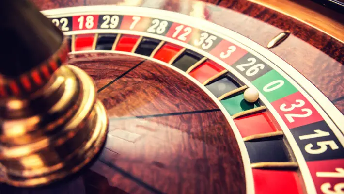 Roulette,Wheel,In,Casino,With,Ball,On,Green,Position,Zero.