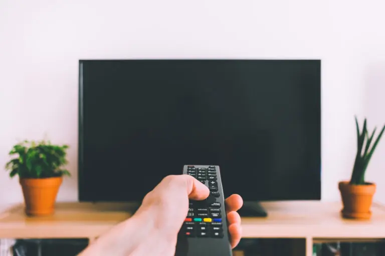 Television,With,Remote,Control,In,Hand,Mockup