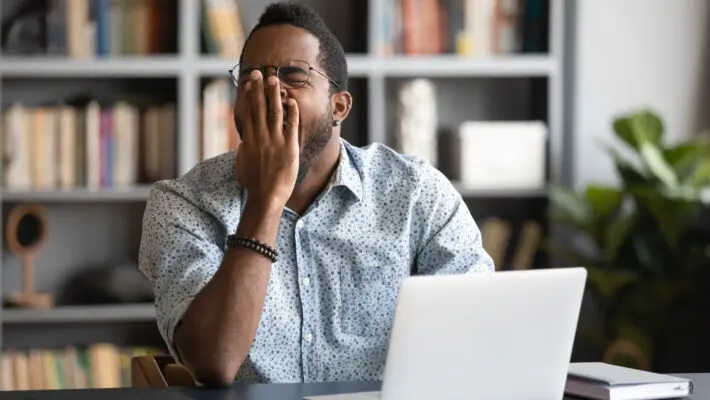 Tired,African,American,Male,Worker,Or,Student,Sit,At,Desk