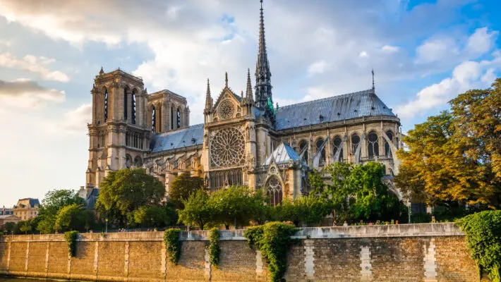 Gorgeous,Sunset,Over,Notre,Dame,Cathedral,With,Puffy,Clouds,,Paris,