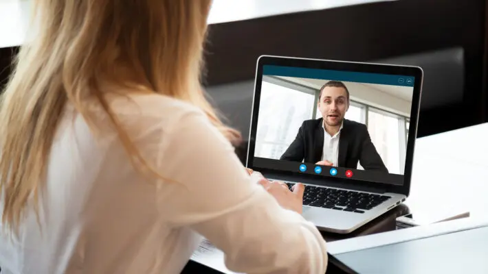 Businesswoman,Making,Video,Call,To,Business,Partner,Using,Laptop,,Looking