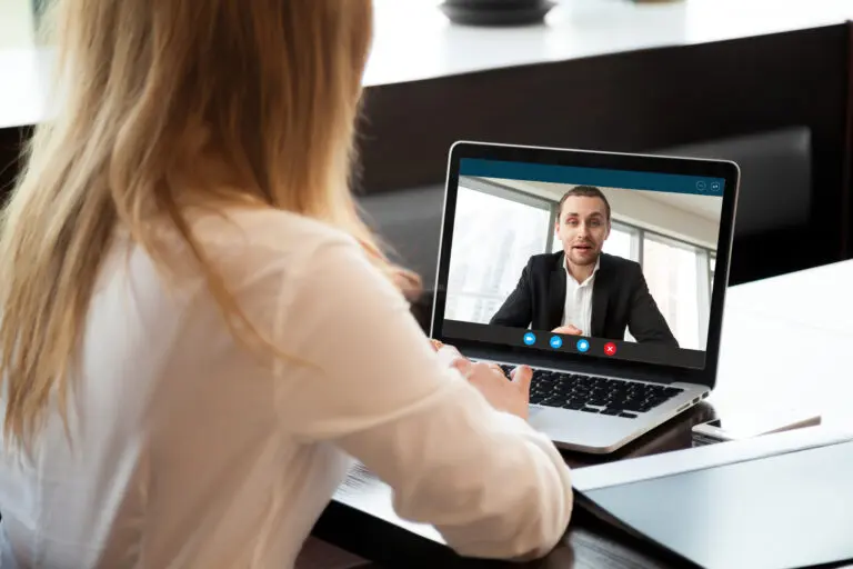 Businesswoman,Making,Video,Call,To,Business,Partner,Using,Laptop,,Looking