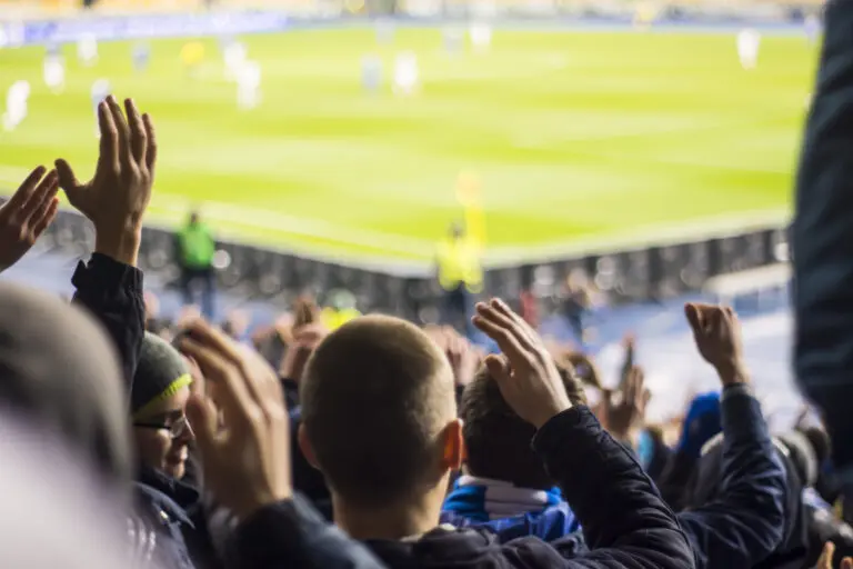 Hand,Fans,Who,Clap,Their,Hands,At,The,Stadium