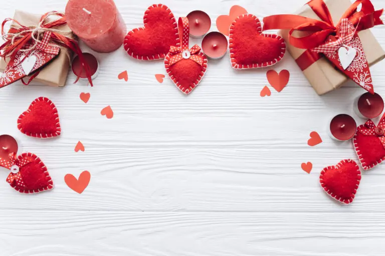 Wooden,White,Background,With,Red,Hearts,,Gifts,And,Candles.,The