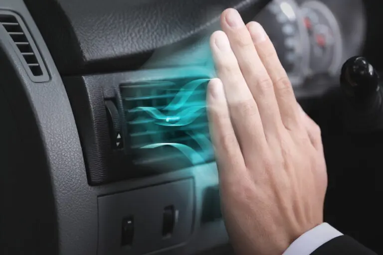 Driver,Checking,Flow,Of,Cold,Air,From,Conditioning,System,In