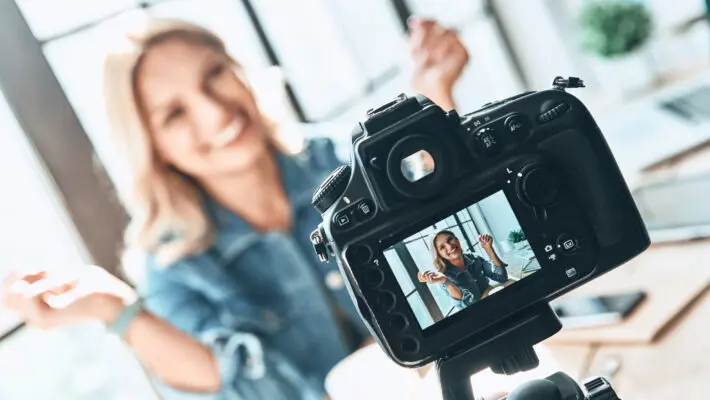 Filming.,Beautiful,Young,Woman,In,Casual,Wear,Smiling,While,Recording