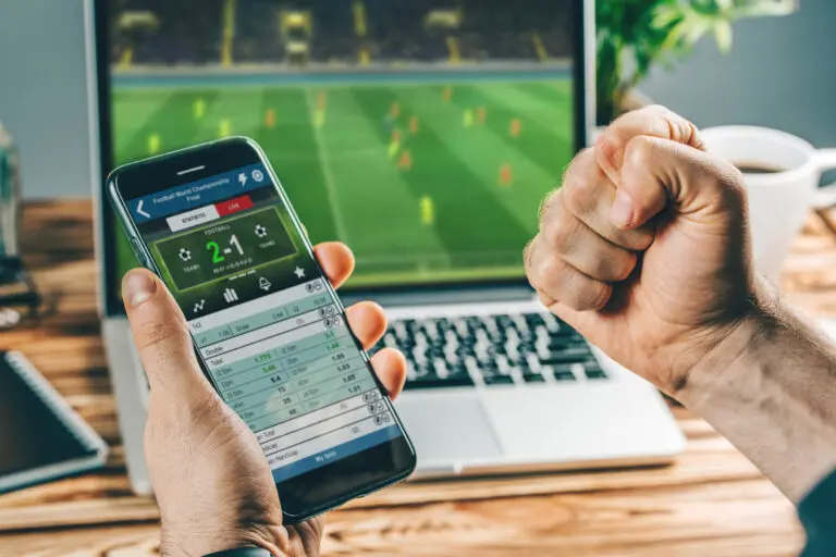 Man,Watching,Football,Play,Online,Broadcast,On,His,Laptop,,Cheering