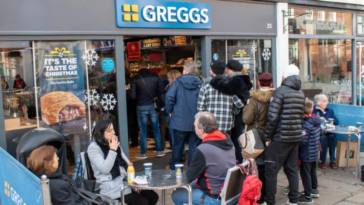 Greggs has warned that inflationary pressures will make its sausage rolls more expensive and curtail profits this year, even as the bakery chain toasted record results.