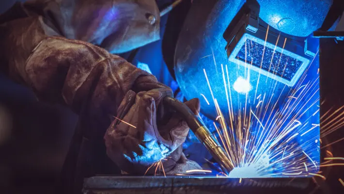 Industrial,Worker,Labourer,At,The,Factory,Welding,Steel,Structure
