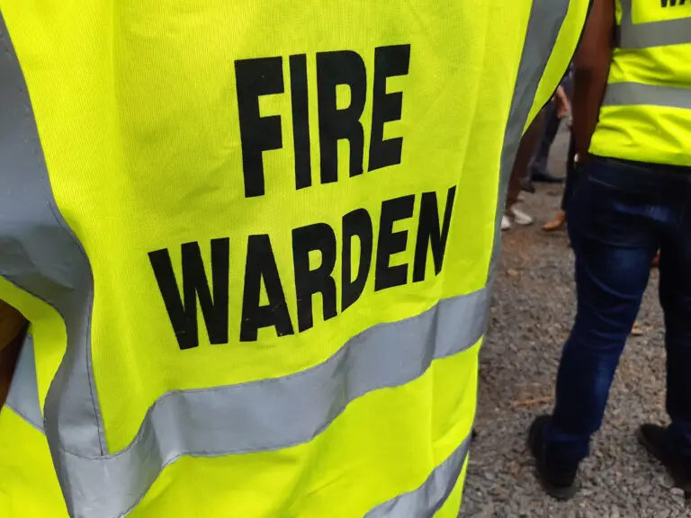 Yellow,Jacket,Showing,Fire,Warden,On,Duty.,Safety,Background.