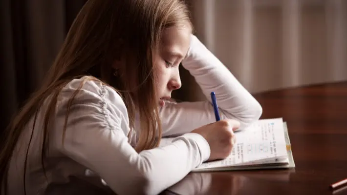Child,Doing,Homework.,Sad,Girl,Writing,,Reeding