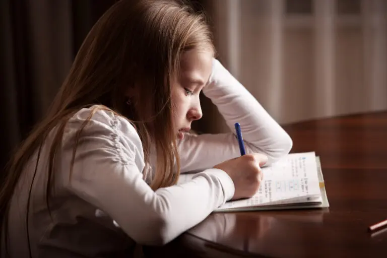 Child,Doing,Homework.,Sad,Girl,Writing,,Reeding