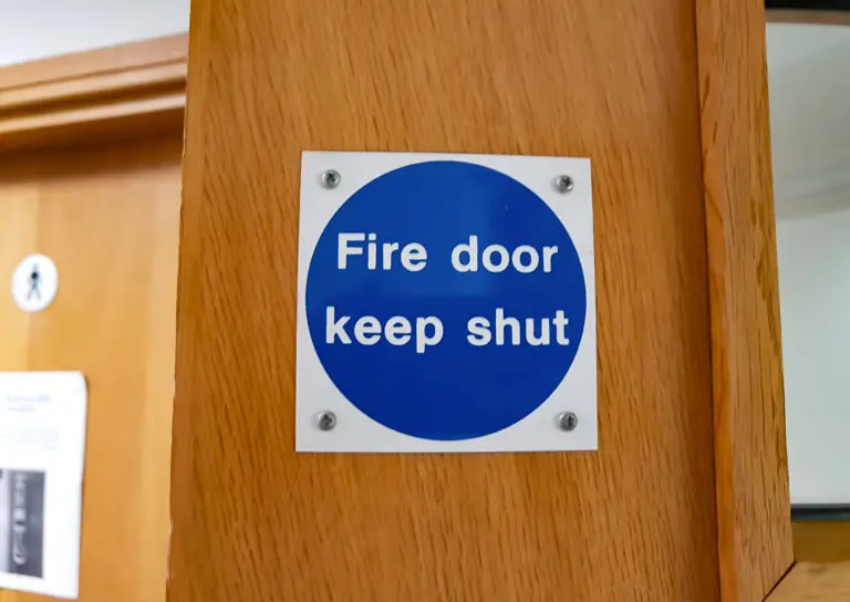 A,Small,Square,Blue,Fire,Door,Sign,On,A,Light
