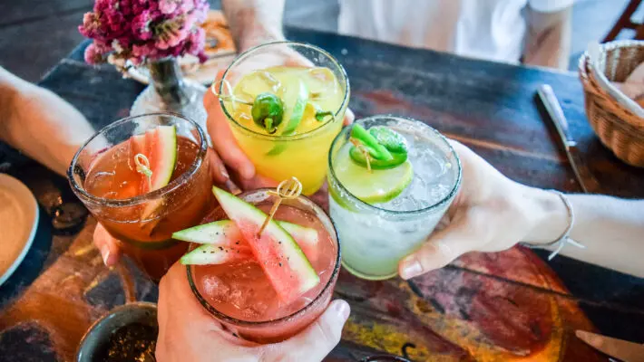 Friends,Toasting,,Saying,Cheers,Holding,Tropical,Blended,Fruit,Margaritas.,Watermelon