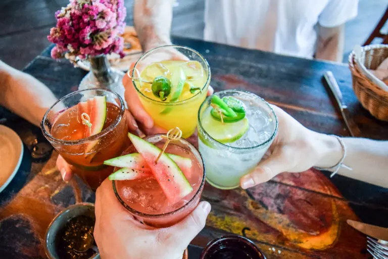 Friends,Toasting,,Saying,Cheers,Holding,Tropical,Blended,Fruit,Margaritas.,Watermelon