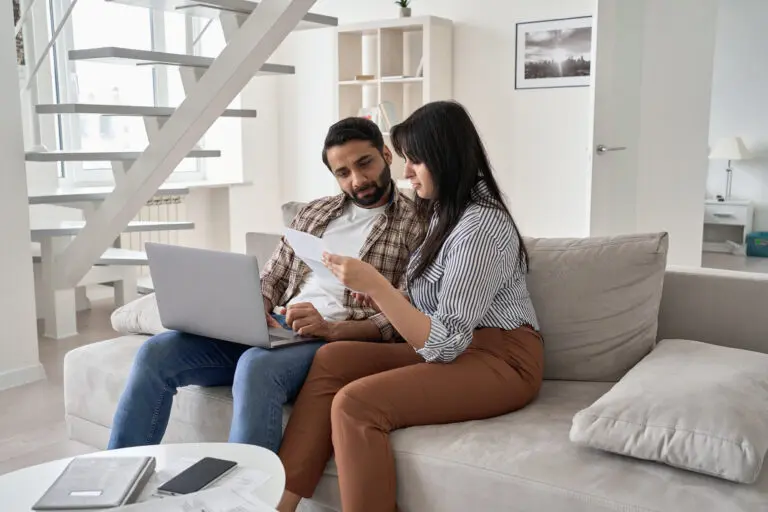 Young,Indian,Couple,Checking,Paper,Bills,Paying,Mortgage,Loan,Bank