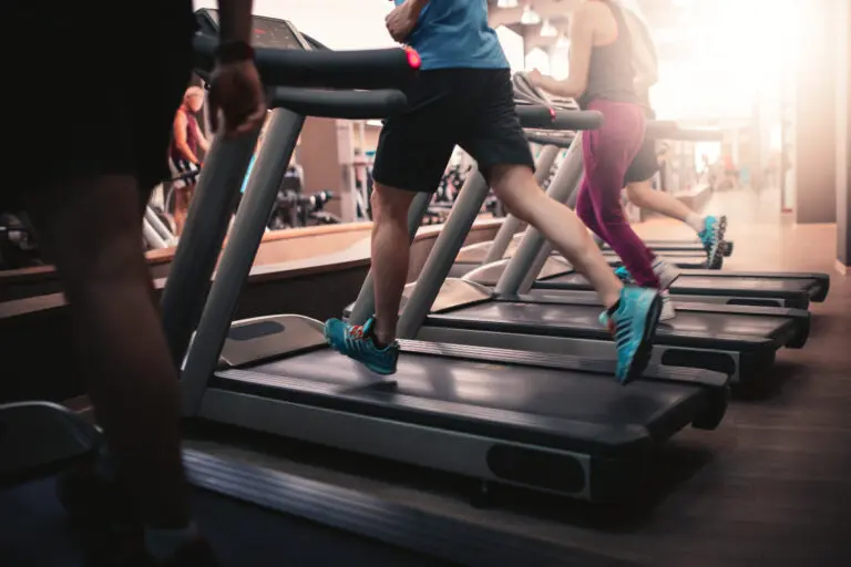 People,Running,In,Machine,Treadmill,At,Fitness,Gym,Club