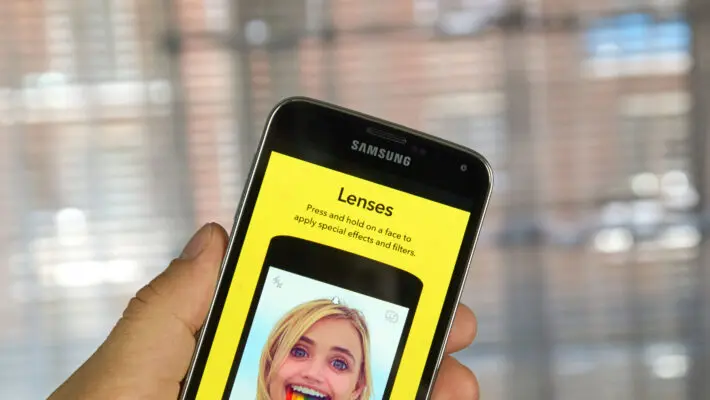 The company behind Snapchat is making about 1,300 staff redundant and cutting investment in projects such as augmented reality glasses, as the social media business fights an advertising downturn.