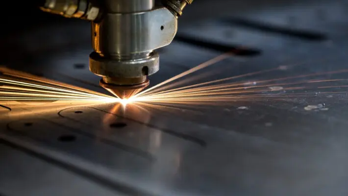 Cutting,Of,Metal.,Sparks,Fly,From,Laser