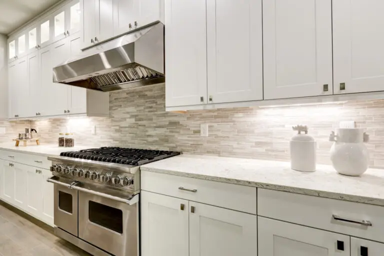 Gourmet,Kitchen,Features,White,Shaker,Cabinets,With,Marble,Countertops,Paired
