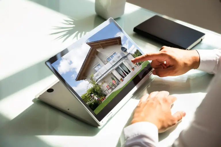 Close-up,Of,Businessman’s,Hand,Checking,House,On,Laptop