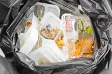 Britain's major retailers and food manufacturers are increasing their lobbying efforts to postpone significant environmental reforms that will require them to pay for the collection and recycling of household packaging waste from next year.